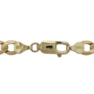 Bring bold strength and golden luxury to your collection with this pre-owned 9ct yellow gold curb chain—a substantial design with powerful presence, perfect for statement wear.

Design: The 20" chain features traditional curb links, measuring 7mm in width for a wide and striking look.
Material: Made from 9-carat yellow gold, the polished finish enhances the smooth links and adds timeless appeal.
