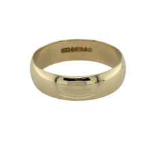 Load image into Gallery viewer, Bring timeless simplicity and classic elegance to your collection with this pre-owned 9ct yellow gold wedding band ring, offering enduring style—perfect as a wedding ring, commitment band, or everyday piece of fine jewellery.

Design: The ring features a smooth and polished 6mm wide band with a traditional rounded profile for a sleek and refined look.
Material: Made from 9-carat yellow gold, the polished finish enhances the warm golden tone with a lasting shine.
 
