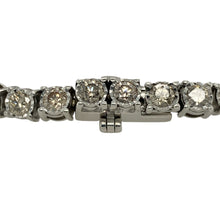 Load image into Gallery viewer, Bring dazzling brilliance and timeless elegance to your collection with this pre-owned 9ct white gold diamond bracelet, offering luxurious sparkle and refined design—perfect for special occasions or statement wear.

Design: The bracelet measures 7&quot; in length and is set with diamonds along its length, creating a continuous display of light and brilliance.
Material: Made from 9-carat white gold, the polished finish provides a sleek backdrop that enhances the sparkle of the diamonds.

