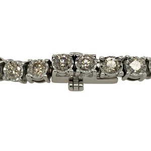 Bring dazzling brilliance and timeless elegance to your collection with this pre-owned 9ct white gold diamond bracelet, offering luxurious sparkle and refined design—perfect for special occasions or statement wear.

Design: The bracelet measures 7" in length and is set with diamonds along its length, creating a continuous display of light and brilliance.
Material: Made from 9-carat white gold, the polished finish provides a sleek backdrop that enhances the sparkle of the diamonds.
