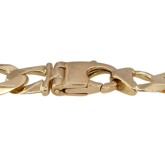 Make a powerful statement with this pre-owned 9ct yellow solid gold curb bracelet, a substantial design with bold presence—perfect for those who appreciate standout jewellery.

Design: The bracelet features classic curb links, measuring an impressive 15mm in width for maximum impact.
Material: Made from solid 9-carat yellow gold, the polished finish enhances the warm tone and ensures lasting durability.
