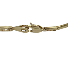 Load image into Gallery viewer, Bring symbolic beauty and refined sparkle to your collection with this pre-owned 9ct yellow gold Celtic knot bracelet—an elegant design with timeless meaning.

Design: The 7.5&quot; bracelet features intricate Celtic knot links, highlighted by a central cubic zirconia stone measuring 3mm in diameter for a touch of brilliance.
Material: Made from 9-carat yellow gold, the polished finish enhances the warm golden tone and complements the detailed knotwork.
