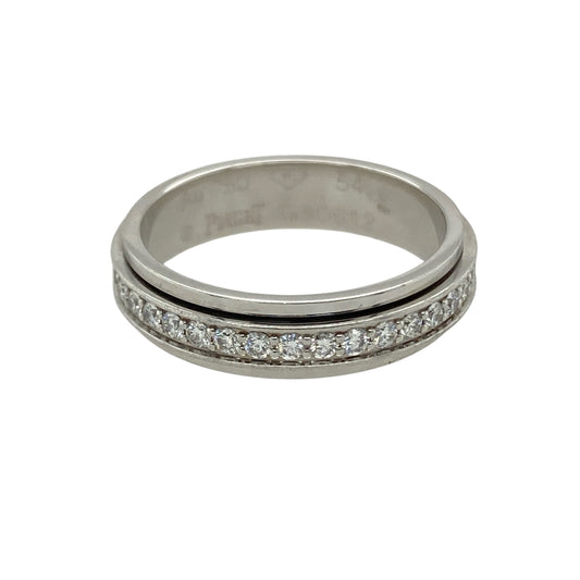 Add sparkle with a twist to your collection with this pre-owned 18ct white gold diamond spinning band ring, a unique design with elegance and movement.

Design: The ring features a 5mm wide spinning band, fully set with diamonds all around for continuous brilliance.
Material: Made in 18-carat white gold, the polished finish provides a sleek backdrop that enhances the diamonds’ radiance.
Ring Detail: With approximately 0.54ct of total diamond content, this ring offers eye-catching sparkle from every angle.