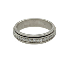 Load image into Gallery viewer, Add sparkle with a twist to your collection with this pre-owned 18ct white gold diamond spinning band ring, a unique design with elegance and movement.

Design: The ring features a 5mm wide spinning band, fully set with diamonds all around for continuous brilliance.
Material: Made in 18-carat white gold, the polished finish provides a sleek backdrop that enhances the diamonds’ radiance.
Ring Detail: With approximately 0.54ct of total diamond content, this ring offers eye-catching sparkle from every angle.
