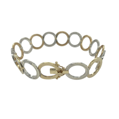 Bring bold elegance and refined sparkle to your collection with this pre-owned 9ct yellow and white gold diamond circle link bracelet, a striking design perfect for statement wear.

Design: The bracelet measures 7.75" in length with 14mm wide circular links, each accented with diamonds to create a luxurious and eye-catching finish.
Material: Made from 9-carat yellow and white gold, the polished surfaces enhance the contrast between the two tones while highlighting the brilliance of the diamonds.