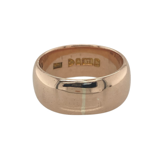 Bring bold elegance and refined warmth to your collection with this pre-owned 9ct rose gold wedding band ring, a substantial design perfect for marking life’s most meaningful moments.

Design: The ring features a wide 9mm band, offering a strong and distinguished profile with contemporary appeal.
Material: Made from 9-carat rose gold, the polished finish enhances the rich pinkish hue of the metal, adding a modern yet timeless glow.