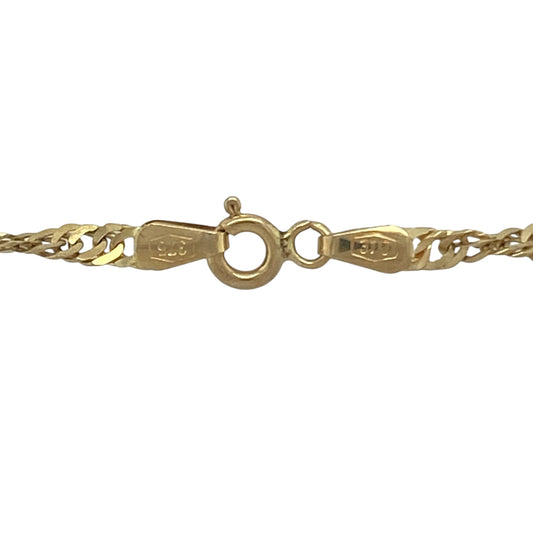 Bring fluid sparkle and elegant movement to your collection with this pre-owned 9ct yellow gold Singapore chain—a versatile design in an extended length for added style.

Design: The chain measures 30 inches in length with 3mm wide twisted Singapore links, creating light-catching texture and graceful flow.
Material: Made from 9-carat yellow gold, the polished finish enhances the chain’s intricate design and warm golden tone.
