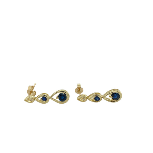 Add timeless elegance and a touch of rich colour to your collection with these pre-owned 9ct yellow gold diamond and sapphire set drop earrings, combining classic design with refined sparkle—perfect for both everyday wear and special occasions.

Design: Each earring features a stunning 4mm by 4mm deep blue sapphire as the focal point, complemented by a sparkling diamond accent above, creating a graceful drop design that catches the light beautifully.
