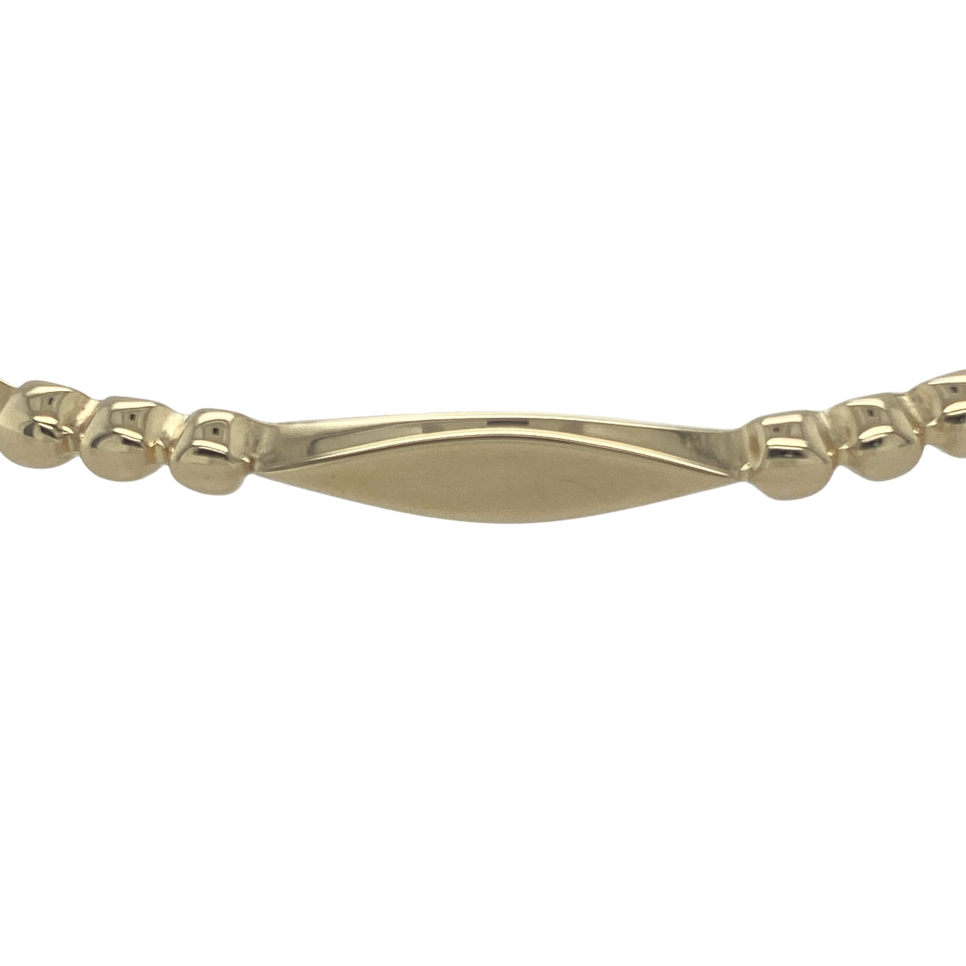 Add classic sophistication and bold style to your collection with this pre-owned 9ct solid yellow gold ball and bar bangle—a timeless design that pairs elegance with everyday wearability.

Design: The bangle features a smooth solid gold bar section measuring approximately 4mm in width, complemented by polished ball details that add a refined finishing touch.
Material: Made from solid 9-carat yellow gold, the high-shine finish enhances the bangle’s warm golden tone and luxurious appearance.
