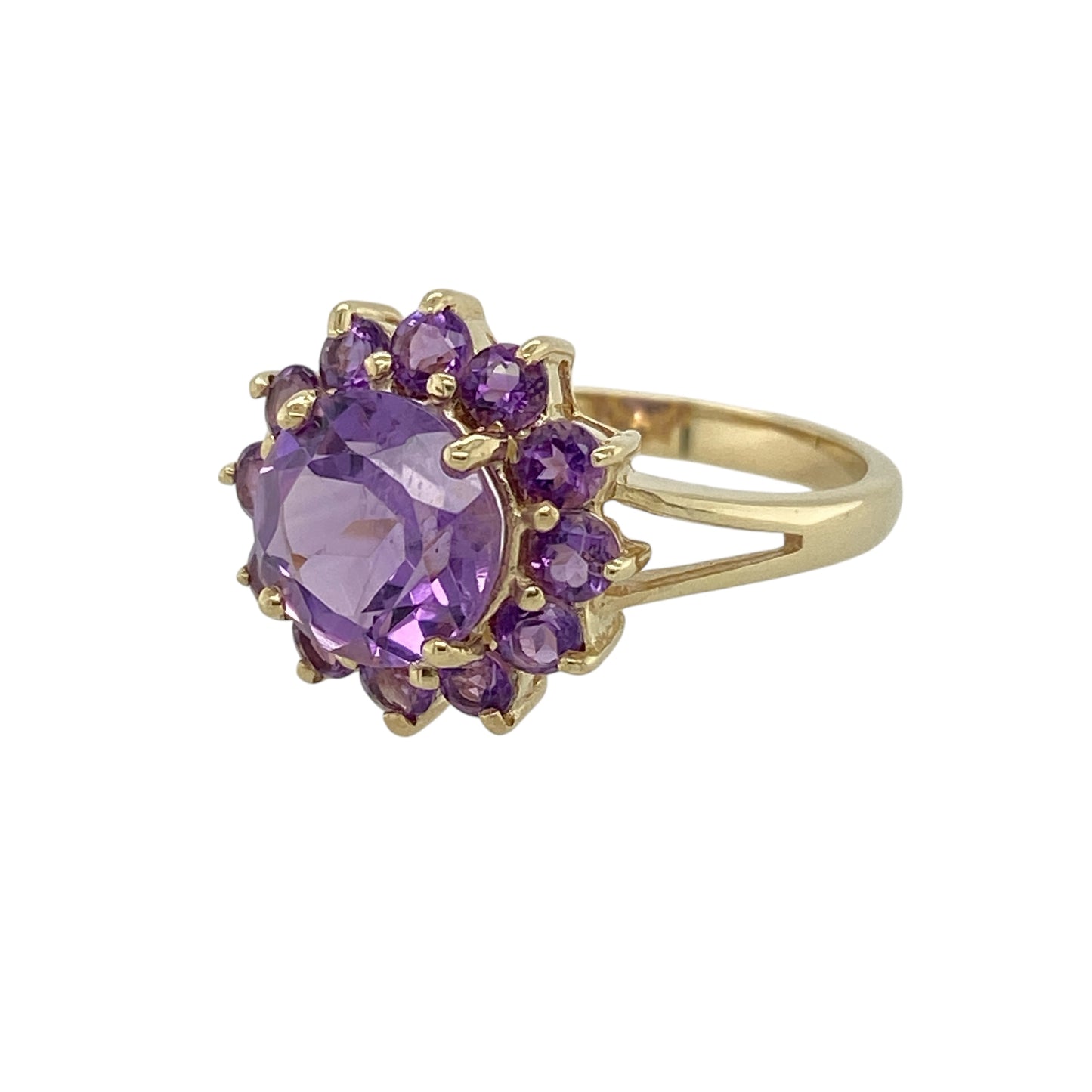 Bring rich colour and classic elegance to your jewellery collection with this pre-owned 9ct yellow gold amethyst set cluster ring, a timeless design with eye-catching charm.

Design: This ring features a striking round amethyst at the centre, surrounded by smaller amethyst stones arranged in a traditional cluster style, creating depth, sparkle, and a beautifully balanced look.
Material: Made from 9-carat yellow gold, the warm polished finish enhances the deep purple tones of the amethyst stones.