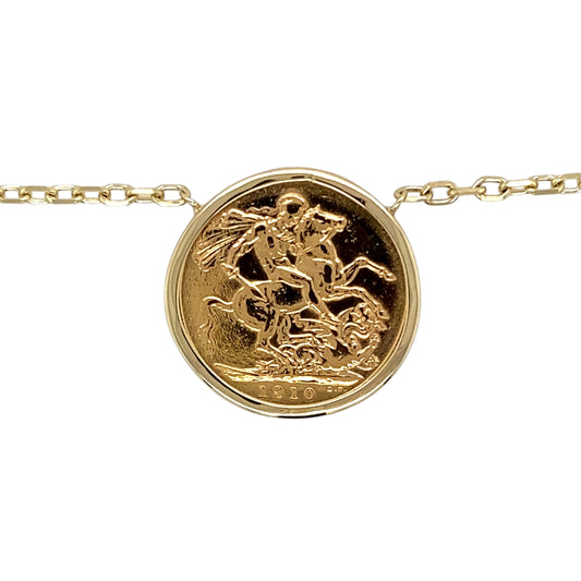 Add a luxurious and historic piece to your jewellery collection with this pre-owned 9ct yellow gold full sovereign mount pendant necklace, featuring:

Design: A classic full sovereign mount pendant, securely holding a genuine 1910 Edward VII full sovereign coin.
Material: The mount and chain are made from 9-carat yellow gold, while the sovereign coin is 22-carat gold, adding richness and value.
Coin Details: Features an Edward VII full sovereign from 1910, a collectible piece with historical significance.

