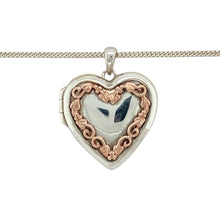 Load image into Gallery viewer, Bring heartfelt meaning and nature-inspired elegance to your collection with this pre-owned 925 silver with 9ct rose gold Clogau Heart Tree of Life locket pendant on an 18&quot; Clogau curb chain, combining timeless design with symbolic depth—perfect for cherished keepsakes or meaningful gifting.

Design: The 2.8cm long heart-shaped locket features Clogau’s signature Tree of Life motif in 9ct rose gold, representing growth, strength, and connection. 
