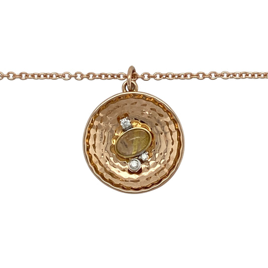 Bring storytelling charm and refined sparkle to your collection with this pre-owned 18ct rose gold Clogau 'Panning for Gold' pendant necklace—an elegant design inspired by Welsh heritage and natural beauty.

Design: The pendant features a faceted quartz stone symbolising a gold nugget, accented by a single diamond and set in an intricate 2.3cm design, including the bail.
Material: Made from 18-carat rose gold, the warm tones complement the soft shimmer of the quartz and add richness to the detailed design.
