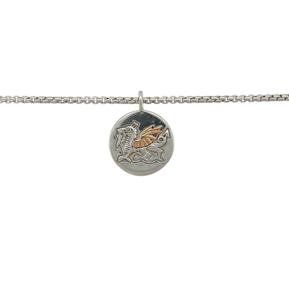 Bold in meaning and crafted with pride, this pre-owned Clogau necklace features the iconic WRU Welsh Dragon emblem—perfect for supporters, collectors, or as a symbol of national heritage.

Design: The necklace features a 2.1cm round pendant (including the bail) with the official Welsh Rugby Union (WRU) Welsh Dragon emblem in 925 silver, accented with 9ct rose gold for added warmth and depth.

