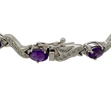 Load image into Gallery viewer, Bring vibrant colour and refined sparkle to your collection with this pre-owned 18ct white gold diamond and amethyst bracelet—perfect for adding elegance to both everyday wear and special occasions.

Design: The 7.25&quot; bracelet features 13 oval amethyst stones, each measuring 6mm by 4mm, interspersed with diamonds for a balanced and eye-catching look.
Material: Made from 18-carat white gold, the polished finish enhances the brilliance of the diamonds and the rich purple hue of the amethysts.

