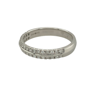 Add refined sparkle to your collection with this pre-owned 18ct white gold diamond two row band ring, a timeless design with elegant brilliance—perfect for everyday wear or special occasions.

Design: The ring features two rows of sparkling diamonds across the front of the band, creating a balanced and sophisticated look.
Material: Made from 18-carat white gold, the polished finish enhances the brilliance of the diamonds and provides a sleek, modern backdrop.
