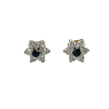 Load image into Gallery viewer, Bring colour and sparkle to your collection with these pre-owned 9ct yellow gold stud earrings, styled in a delicate flower design with sapphire and cubic zirconia.

Design: Each earring features a central sapphire-coloured stone surrounded by sparkling cubic zirconia petals, creating a refined floral look.
Material: Made from 9-carat yellow gold, the polished finish enhances the warm golden tone and complements the vibrant stones.
