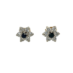 Bring colour and sparkle to your collection with these pre-owned 9ct yellow gold stud earrings, styled in a delicate flower design with sapphire and cubic zirconia.

Design: Each earring features a central sapphire-coloured stone surrounded by sparkling cubic zirconia petals, creating a refined floral look.
Material: Made from 9-carat yellow gold, the polished finish enhances the warm golden tone and complements the vibrant stones.