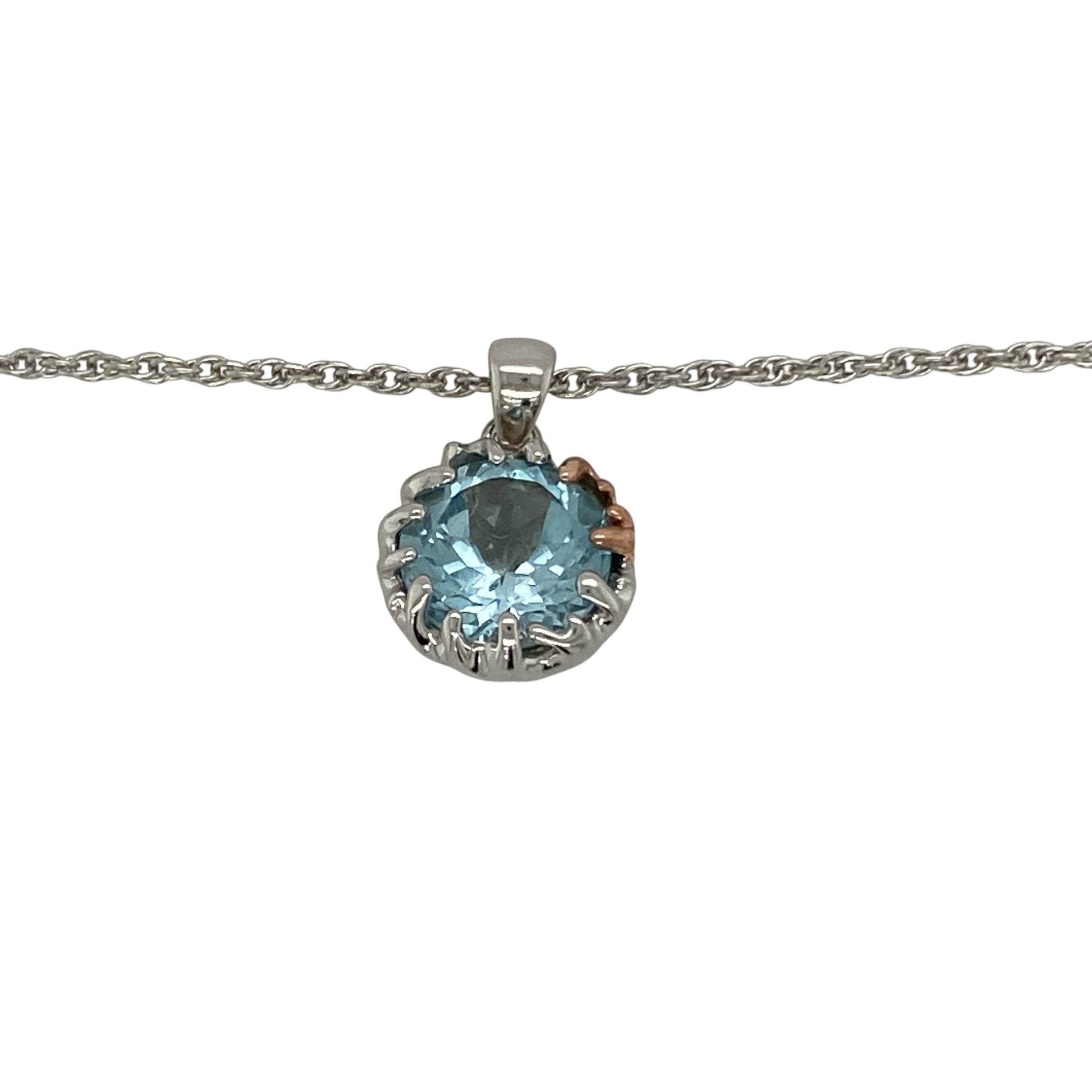 Bring vibrant colour and timeless elegance to your collection with this pre-owned silver and blue topaz pendant, paired with an adjustable Clogau Prince of Wales chain for versatile styling.

Design: The pendant measures 2cm long including the bail and showcases a striking 11mm round blue topaz stone, creating a bold and eye-catching focal point.
Material: Made from 925 sterling silver and set with blue topaz, the polished finish enhances the vivid colour and brilliance of the gemstone.