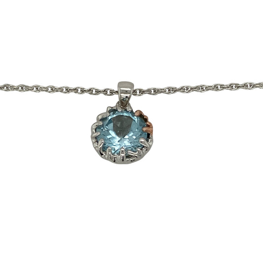 Bring vibrant colour and timeless elegance to your collection with this pre-owned silver and blue topaz pendant, paired with an adjustable Clogau Prince of Wales chain for versatile styling.

Design: The pendant measures 2cm long including the bail and showcases a striking 11mm round blue topaz stone, creating a bold and eye-catching focal point.
Material: Made from 925 sterling silver and set with blue topaz, the polished finish enhances the vivid colour and brilliance of the gemstone.