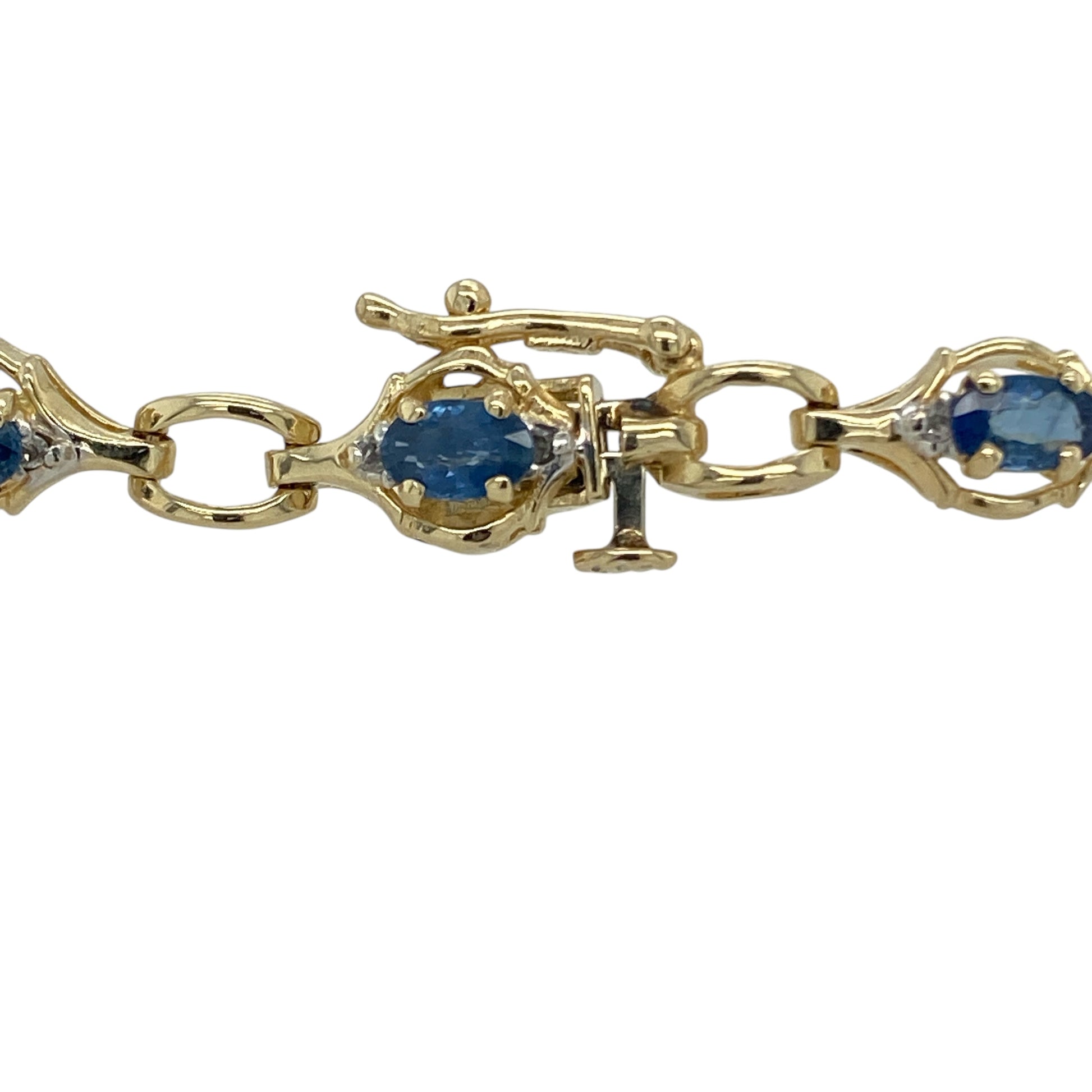 Bring timeless luxury and classic colour to your collection with this pre-owned 14ct yellow gold diamond and sapphire bracelet, combining elegant design with refined brilliance—perfect for special occasions or sophisticated everyday wear.

Design: The bracelet features alternating rich blue sapphire stones, each measuring 5mm by 3mm, and sparkling diamonds that add radiant contrast and elegance to the piece. Measuring 7.25 inches in length, it offers a graceful and balanced fit on the wrist.