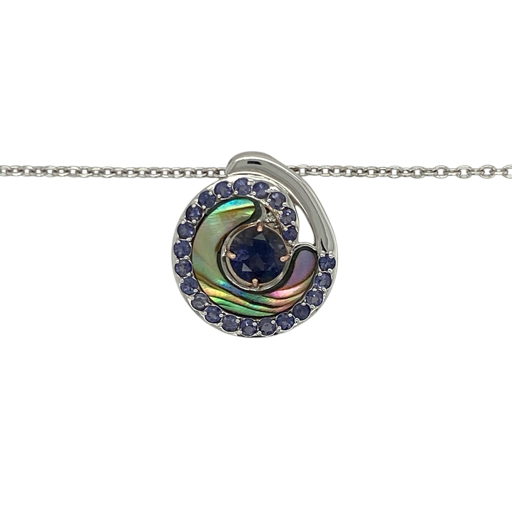 Bring ocean-inspired elegance and soft colour to your collection with this pre-owned 925 silver and 9ct rose gold iolite set Clogau Ebb and Flow Abalones pendant necklace—perfect for adding a touch of natural beauty and sophistication to any outfit.

Design: The 2cm-long pendant features a captivating 6mm round iolite stone at its centre, showcasing deep violet-blue tones reminiscent of the sea.
