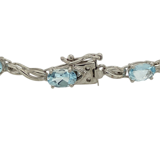 Bring fresh colour and refined elegance to your jewellery collection with this pre-owned 9ct white gold & blue topaz set bracelet, offering timeless style with a graceful finish.

Design: The bracelet features oval blue topaz stones set along its length, creating a delicate and balanced look with soft flashes of light blue colour.
Material: Made from 9-carat white gold, the bright polished finish beautifully complements the cool tones of the blue topaz stones.
