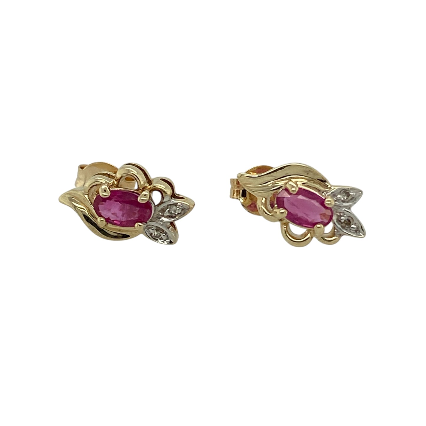 Bring classic colour and delicate sparkle to your jewellery collection with these pre-owned 9ct yellow gold diamond & ruby set flower style stud earrings, a timeless and elegant design.

Design: Each stud features a floral-inspired arrangement centred with an oval ruby measuring 5mm by 3mm, creating a rich red focal point accented by diamonds for added brilliance.
Material: Made from polished 9-carat yellow gold, the warm tone beautifully enhances the deep hue of the rubies and the sparkle of the diamonds.