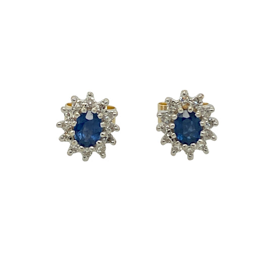 Bring classic colour and refined sparkle to your jewellery collection with these pre-owned 9ct yellow and white gold diamond & sapphire set cluster stud earrings, a timeless design with elegant contrast.

Design: Each stud features an oval sapphire measuring 4mm by 3mm, forming the centre of a traditional cluster arrangement, accented with diamonds for added brilliance.