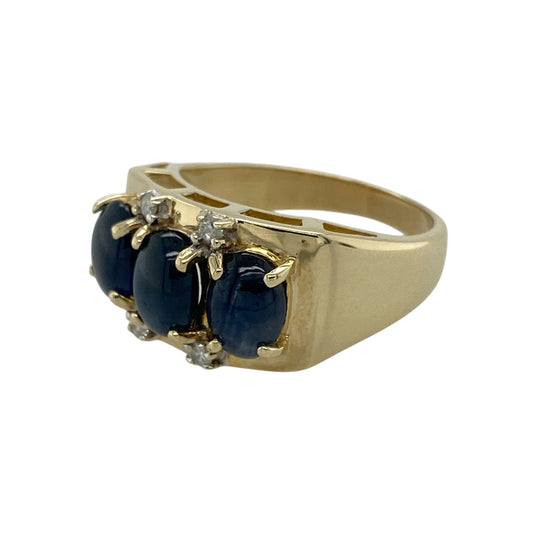 Bring striking colour and refined elegance to your jewellery collection with this pre-owned 9ct yellow gold diamond and sapphire set trilogy ring, a beautifully balanced design with timeless appeal.

Design: The ring features three rich blue oval sapphires arranged in a classic trilogy style, each accented with diamonds set above and below to enhance sparkle and create a luxurious, layered look.
