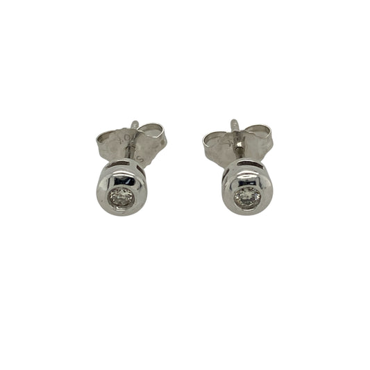 Bring classic brilliance and timeless elegance to your jewellery collection with this pre-owned 10ct white gold diamond rubover set stud earrings, a refined pair designed for effortless everyday wear.

Design: These stud earrings feature a clean and modern rubover-style surround, highlighting the diamonds while offering a smooth and secure finish.
Material: Made from 10-carat white gold, the bright polished finish enhances the diamonds’ sparkle and provides a contemporary, versatile look.