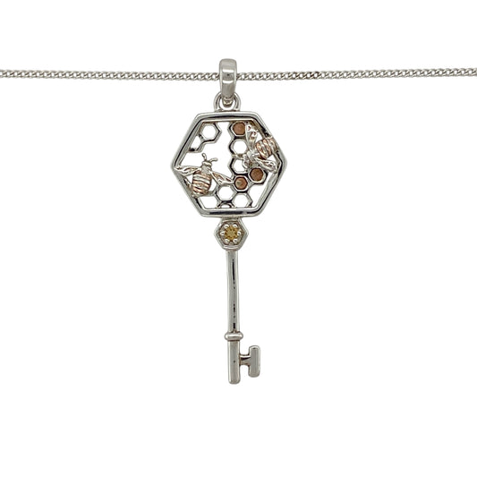 Bring symbolic charm and signature Welsh style to your jewellery collection with this pre-owned 925 silver and 9ct rose gold Clogau bee key pendant necklace.

Design: The pendant features a beautifully detailed key design adorned with a bee motif and a warm citrine stone, symbolising prosperity and positivity. The pendant measures approximately 4.1cm in length including the bail, creating an elegant and eye-catching statement.