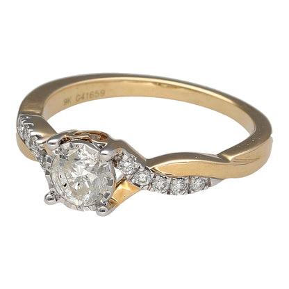 New 9ct Yellow and White Gold & Diamond Illusion Set Solitaire Twist Ring in size M with the weight 2.80 grams. There is approximately 0.64ct of diamond content in total with approximate clarity i1 and colour K - M