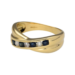 Preowned 18ct Yellow Gold Diamond & Sapphire Set Crossover Band Ring in size L with the weight 4.10 grams. The band is 4mm wide in the middle and 7mm wide at the sides