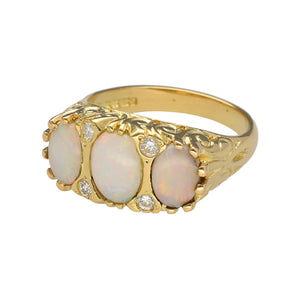 Preowned 18ct Yellow Gold Diamond & Opal Set Antique Style Ring in size M with the weight 6.30 grams. The center opal stone is 8mm by 6mm and the side opals are each 7mm by 5mm