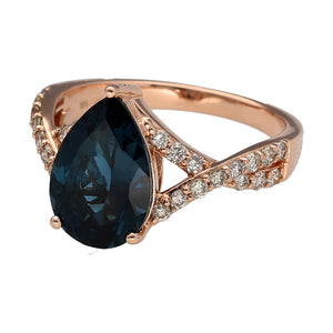 Preowned 14ct Rose Gold Diamond & Teardrop Blue Topaz Set Dress Ring in size M with the weight 4.70 grams. The topaz stone is 12mm by 8mm