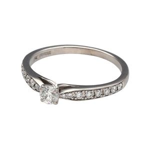 Preowned 18ct White Gold & Diamond Set Solitaire Ring in size Q with the weight 3.40 grams. The center stone is approximately 25pt with approximate clarity Si and colour M - N. The ring has diamond set shoulders 