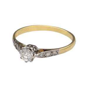 Preowned 18ct Yellow and White Gold & Diamond Set Solitaire Ring in size R with the weight 2 grams. The diamond is approximately 28pt of diamond content