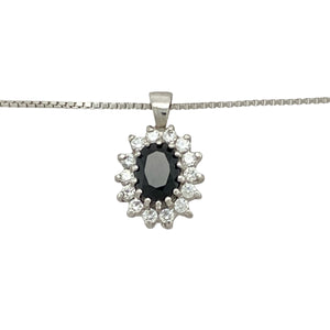 Add classic sparkle and rich colour to your jewellery collection with this pre-owned 9ct white gold sapphire and cubic zirconia cluster pendant necklace, featuring:

Design: A timeless cluster setting with a deep blue central stone surrounded by brilliant cubic zirconia, creating a radiant and refined look.
Material: 9-carat white gold, offering a cool, polished finish that enhances the brilliance of the stones.