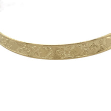 Load image into Gallery viewer, Add sentimental charm and timeless style to a little one’s collection with this pre-owned 9ct yellow gold heart and flower patterned expanding baby bangle—sweet, meaningful, and ideal for a special gift.

Design: The bangle features a delicate engraved pattern of hearts and flowers across the 5mm wide band, adding soft decorative detail with a classic touch.
Material: Made from 9-carat yellow gold, the polished finish enhances the engraved design with a warm, gentle glow.

