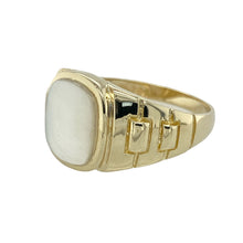 Load image into Gallery viewer, Add vintage flair and unique texture to your collection with this pre-owned 9ct yellow gold and mother of pearl signet ring—perfect for bold styling with a refined twist.

Design: The ring features an 11mm by 10mm mother of pearl stone with a soft iridescent finish, framed by distinctive watch strap style shoulders for a masculine, retro-inspired look.
Material: Made from 9-carat yellow gold, the polished finish enhances both the warm tone of the metal and the natural shimmer of the mother of pearl.

