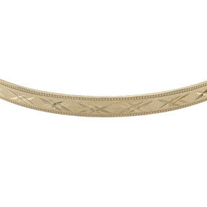Bring classic elegance and refined texture to your collection with this pre-owned 9ct yellow solid gold patterned bangle, offering timeless detail and a graceful finish — perfect for everyday sophistication or special occasion wear.

Design: This elegant bangle features a 4mm width with intricate patterning, adding subtle texture and visual interest to its sleek, polished form.
Material: Made from solid 9-carat yellow gold, the radiant finish enhances its rich golden hue