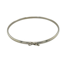 Load image into Gallery viewer, Bring sleek elegance and timeless simplicity to your collection with this pre-owned 9ct white gold plain bangle, offering a versatile design with refined style—perfect for everyday wear or layering.

Design: The bangle measures 6cm in diameter with a 3mm width, creating a smooth and minimal profile for a classic look.
Material: Made from solid 9-carat white gold, the polished finish enhances the bangle with a bright, modern shine.

