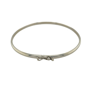 Bring sleek elegance and timeless simplicity to your collection with this pre-owned 9ct white gold plain bangle, offering a versatile design with refined style—perfect for everyday wear or layering.

Design: The bangle measures 6cm in diameter with a 3mm width, creating a smooth and minimal profile for a classic look.
Material: Made from solid 9-carat white gold, the polished finish enhances the bangle with a bright, modern shine.
