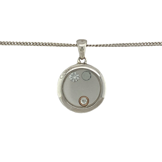 Bring modern elegance and subtle sparkle to your collection with this pre-owned Clogau circular stone set pendant in silver and 9ct rose gold, paired with an adjustable curb chain for versatile wear.

Design: The pendant measures 2.3cm long including the bail, featuring a circular open design adorned with sparkling stones set inside, accented with 9ct rose gold for warmth and contrast.