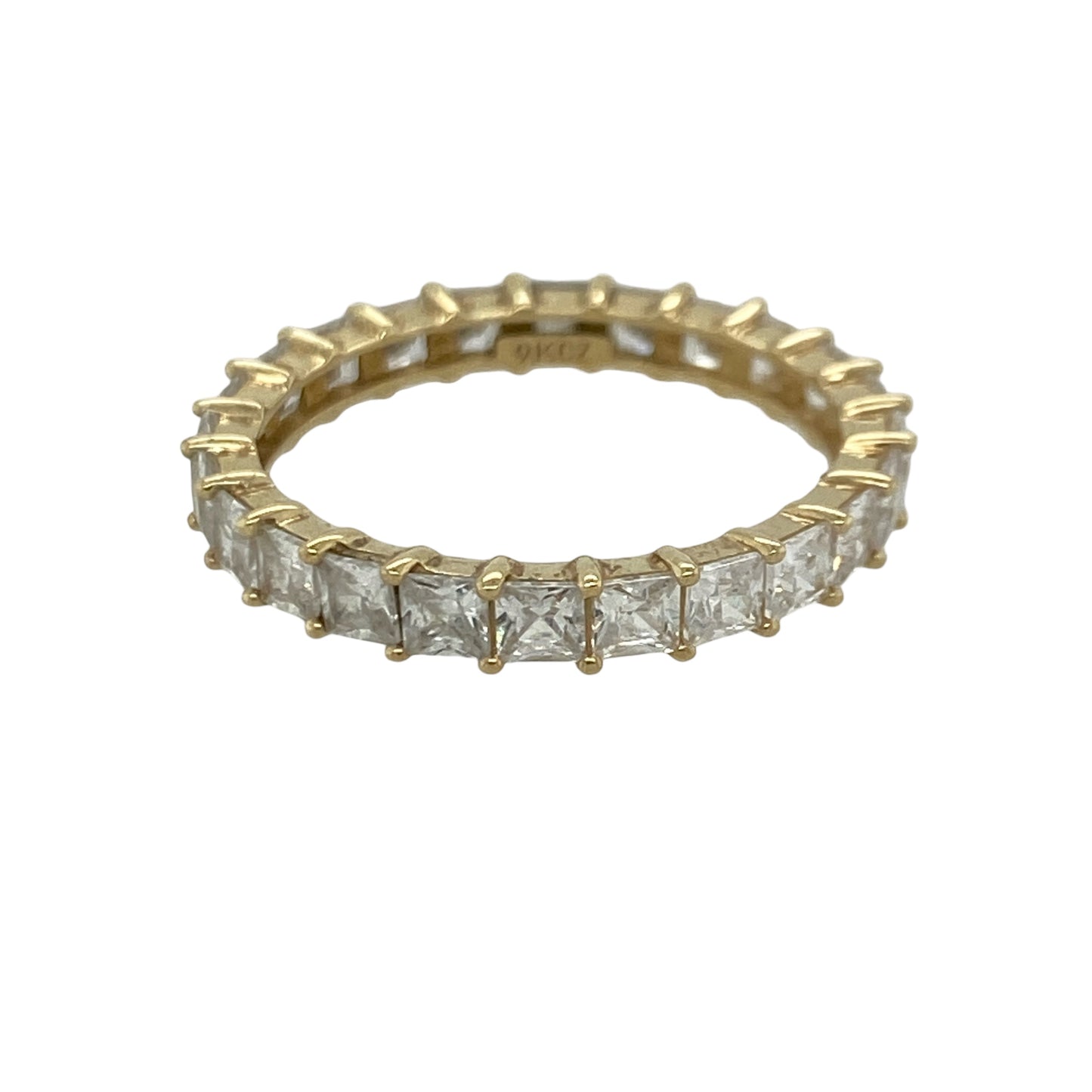 Add timeless sparkle and contemporary elegance to your jewellery collection with this pre-owned 9ct yellow gold cubic zirconia eternity band ring, featuring a striking full eternity design with brilliant square-cut stones—perfect for stacking, gifting, or celebrating a special occasion.

Design: The ring features sparkling square-cut cubic zirconia stones set around the entire band, creating a continuous display of brilliance and a sophisticated geometric look.