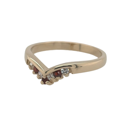 This pre-owned 9ct yellow gold garnet and cubic zirconia wishbone ring is a classic gemstone design, featuring a curved profile with contrasting stone detailing.

Design: Featuring a traditional wishbone shape, this ring combines garnet and cubic zirconia stones across the front in warm 9ct yellow gold.
Material: Made from 9-carat yellow gold.
Gemstone Detail: Set with garnet and cubic zirconia stones within the wishbone design.
Ring Detail: The front of the band measures approximately 3mm wide.
