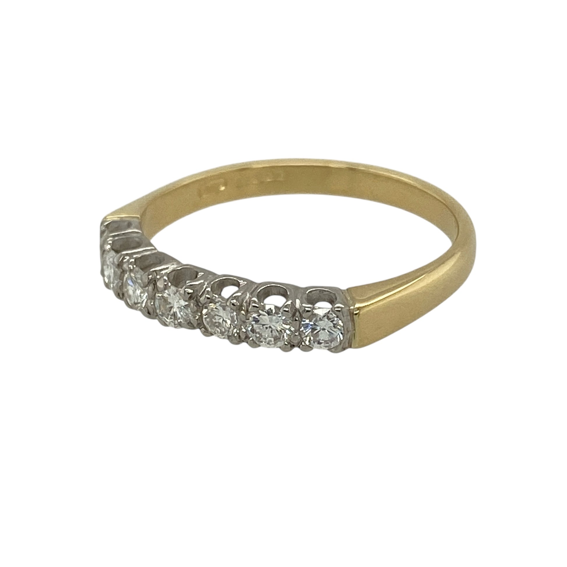 Bring classic elegance and enduring sparkle to your jewellery collection with this pre-owned 18ct yellow gold diamond set seven stone band ring, offering a timeless design with beautifully balanced brilliance—perfect for everyday wear or special occasions.

Design: The ring features seven diamonds arranged in a traditional row across the band, creating a refined and symmetrical look with lasting appeal.
