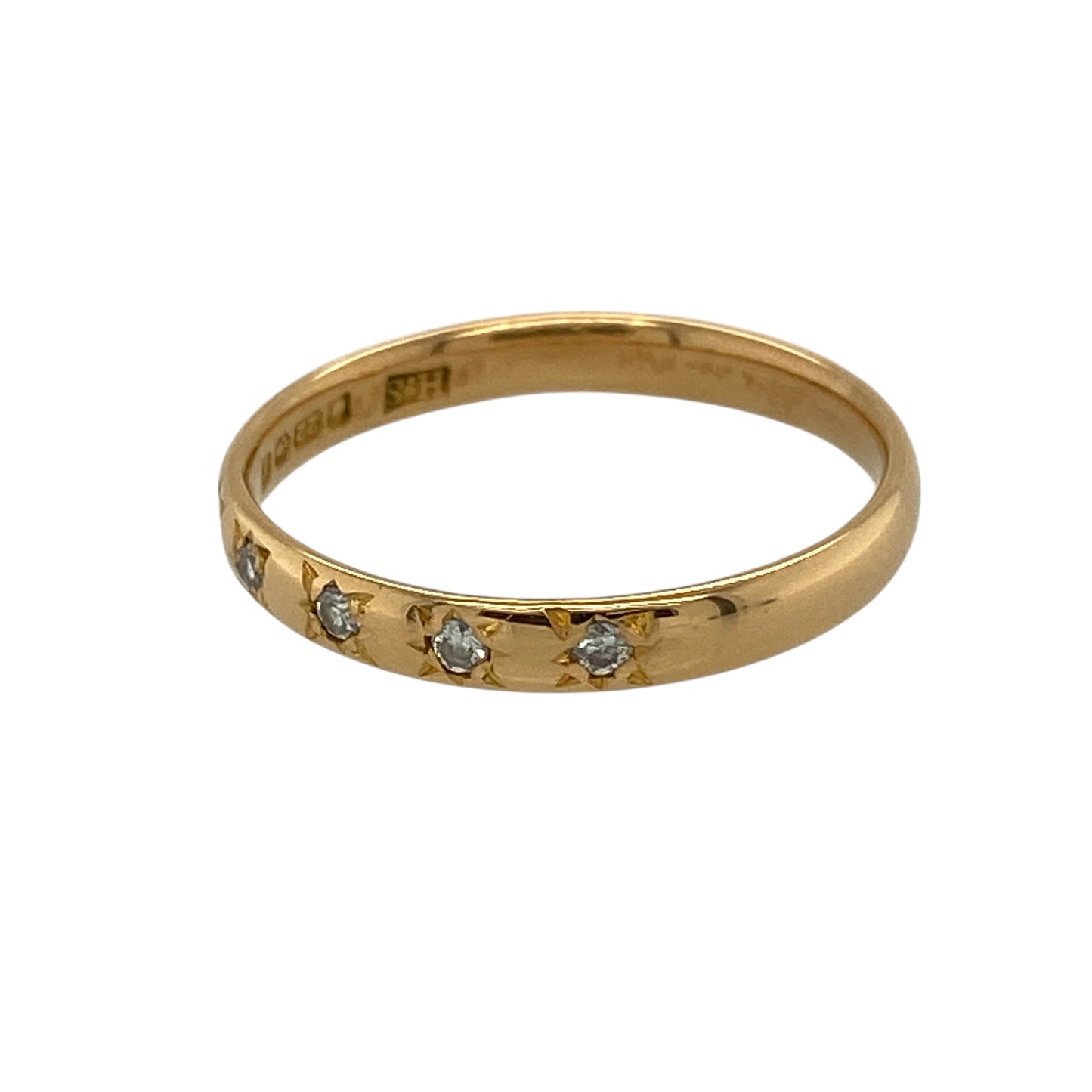 Bring rich gold tone and subtle sparkle to your jewellery collection with this pre-owned 22ct yellow gold diamond set band ring, offering a refined design with understated elegance—perfect for everyday wear or meaningful gifting.

Design: The ring features a slim band measuring approximately 2.5mm in width, with five small diamonds set neatly into the band for a delicate touch of sparkle.