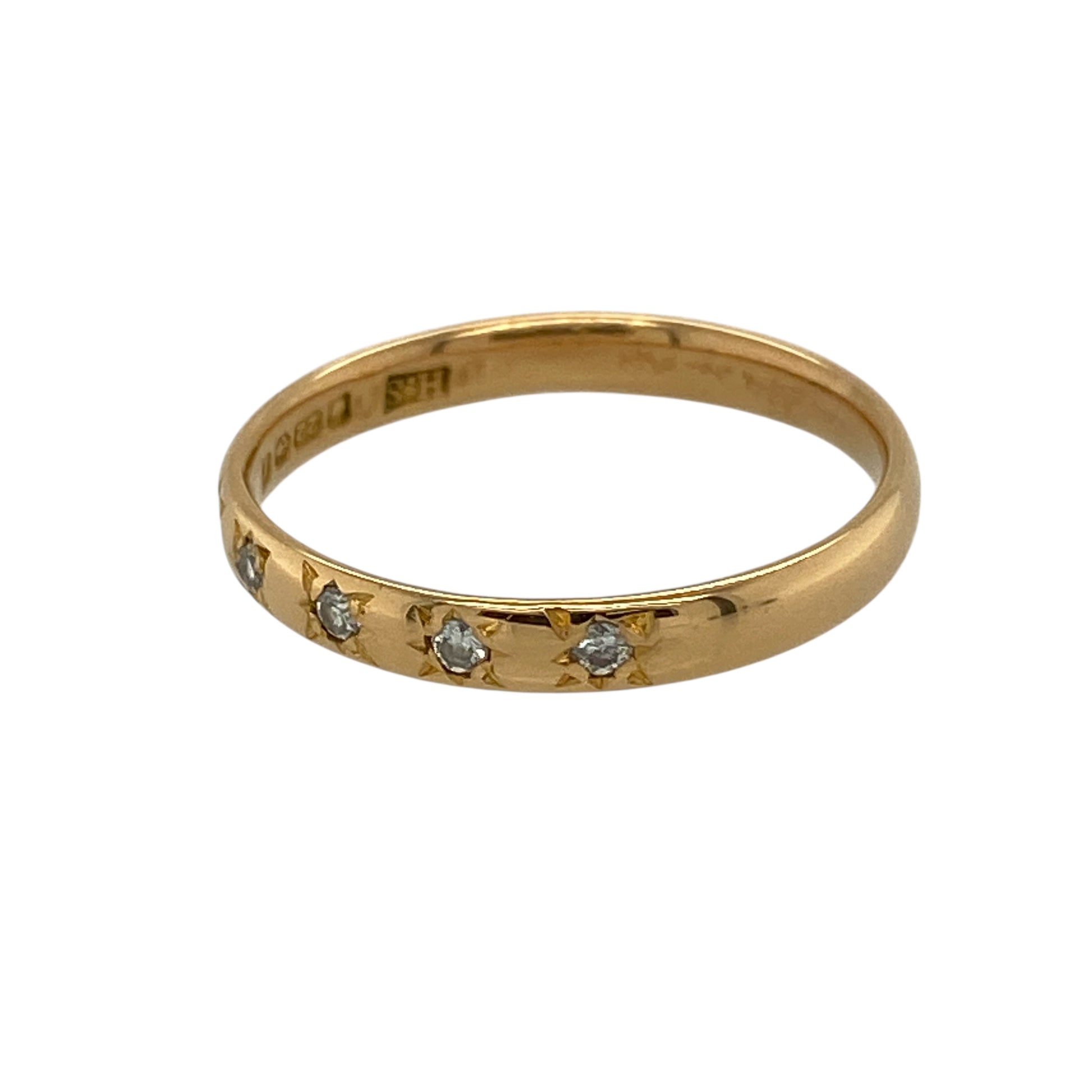 Bring rich gold tone and subtle sparkle to your jewellery collection with this pre-owned 22ct yellow gold diamond set band ring, offering a refined design with understated elegance—perfect for everyday wear or meaningful gifting.

Design: The ring features a slim band measuring approximately 2.5mm in width, with five small diamonds set neatly into the band for a delicate touch of sparkle.